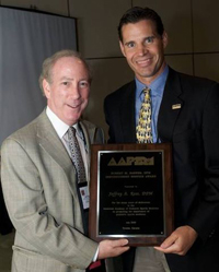 Jeffrey Ross, DPM (left) receives the Robert M. Barnes, DPM Distinguished Service Award from Matt Werd, DPM at the AAPSM Annual Meeting held in Toronto.